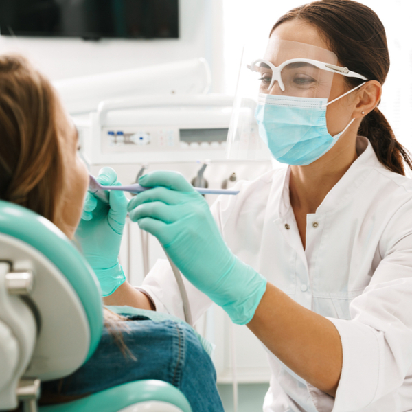 Dental Websites That Rank in Google Female orthodontist working on patient